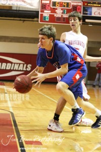 Cody Isern (#23) of the Ellinwood Eagles drives past Hoisington Cardinal Ryan Becker (#5) at the Hoisington Activities Center in Hoisington, Kansas on February 10, 2012.  Photo: Joey Bahr