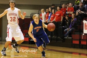 Ellinwood Eagle Gavin Vink (#5) drives past Hoisington Cardinal defender Derrick Kaiser (#32) at the Hoisington Activities Center in Hoisington, Kansas on February 10, 2012.  Photo: Joey Bahr