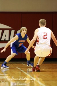 Hoisington Cardinal Trent Schremmer (#2) looks to drive against the defense of Ellinwood Eagle Gavin Vink (#5) at the Hoisington Activities Center in Hoisington, Kansas on February 10, 2012.  Photo: Joey Bahr