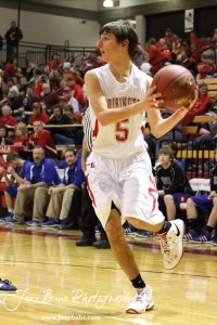 Ryan Becker (#5) of the Hoisington Cardinals looks for a teammate to pass the basketball to against the Ellinwood Eagles at the Hoisington Activities Center in Hoisington, Kansas on February 10, 2012.  Photo: Joey Bahr