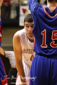 Hoisington Cardinal Cody Stetler (#4) looks through a hole in the Ellinwood Eagle defense while waiting for the basketball to be passed in at the Hoisington Activities Center in Hoisington, Kansas on February 10, 2012.  Photo: Joey Bahr