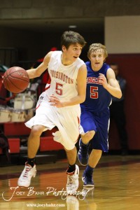 Gavin Vink (#5) of the Ellinwood Eagles pursues Hoisington Cardinal Ryan Becker (#5) at the Hoisington Activities Center in Hoisington, Kansas on February 10, 2012.  Photo: Joey Bahr