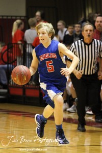 Gavin Vink (#5) of the Ellinwood Eagles drives down the court against the Hoisington Cardinals at the Hoisington Activities Center in Hoisington, Kansas on February 10, 2012.  Photo: Joey Bahr