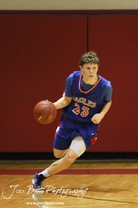 Ellinwood Eagle Cody Isern (#23) drives the basketball down the court  against the Hoisington Cardinals at the Hoisington Activities Center in Hoisington, Kansas on February 10, 2012.  Photo: Joey Bahr