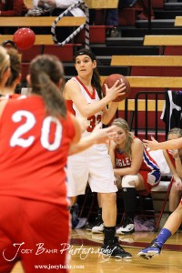 Hoisington Lady Cardinal Mallory Flagor (#32) looks to make a pass to a teammate against the Ellinwood Lady Eagles at the Hoisington Activities Center in Hoisington, Kansas on February 10, 2012.  Photo: Joey Bahr