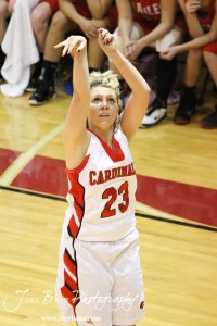 Hoisington Lady Cardinal Blakelee Cooper (#23) watches her three point shot go in against the Ellinwood Lady Eagles at the Hoisington Activities Center in Hoisington, Kansas on February 10, 2012.  Photo: Joey Bahr