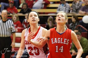 Hoisington Lady Cardinal Brandy Wondra (#20) and Ellinwood Lady Eagle Brooke Panning (#14) watch at free throw attempt at the Hoisington Activities Center in Hoisington, Kansas on February 10, 2012.  Photo: Joey Bahr