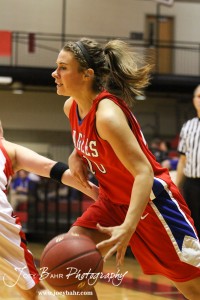 Kelsea Ward (#20) of the Ellinwood Lady Eagles drives into the Hoisington Lady Cardinals defense at the Hoisington Activities Center in Hoisington, Kansas on February 10, 2012.  Photo: Joey Bahr