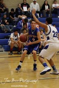 OB_Boys_vs_St_John_BB_2-21-12_0014 Trevor Keller (#3) of the Otis-Bison Cougars looks to make a pass while St. John Tiger Spencer Nusser (#20) defends at St. John High School in St. John, Kansas on February 21, 2012. Photo: Joey Bahr