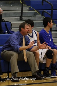 OB_Boys_vs_St_John_BB_2-21-12_0023 St. John Tigers Head Coach Clint Kinnamon sends in some instructions to his team against the Otis-Bison Cougars at St. John High School in St. John, Kansas on February 21, 2012. Photo: Joey Bahr