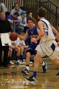 OB_Boys_vs_St_John_BB_2-21-12_0027 Otis-Bison Cougar Trevor Keller (#3) drives down the court against the St. John Tigers at St. John High School in St. John, Kansas on February 21, 2012. Photo: Joey Bahr