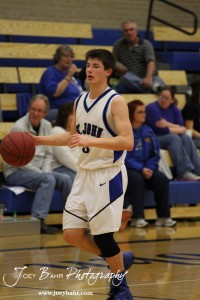 OB_Boys_vs_St_John_BB_2-21-12_0036 St. John Tiger Kade Kinnamon (#3) carries the basketball into the offensive end against the Otis-Bison Cougars at St. John High School in St. John, Kansas on February 21, 2012. Photo: Joey Bahr