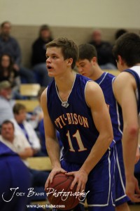 OB_Boys_vs_St_John_BB_2-21-12_0129 Dylan Wissman (#11) of the Otis-Bison Cougars prepares to shoot a free throw against the St. John Tigers at St. John High School in St. John, Kansas on February 21, 2012. Photo: Joey Bahr