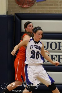 Teresa Christie (#20) tries to get into position in front of Otis-Bison Lady Cougar defender Janel Tammen (#45) at St. John High School in St. John, Kansas on February 21, 2012.  Photo: Joey Bahr