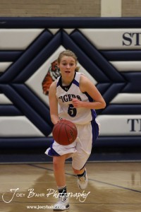 St. John Lady Tiger Jessica Hanson (#5) drives down the court with the basketball against the Otis-Bison Lady Cougars at St. John High School in St. John, Kansas on February 21, 2012.  Photo: Joey Bahr