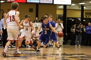 Otis-Bison Cougar Trevor Keller (#3) drives down the court past Greeley County Jackrabbit Troy Wineinger (#10) in the 2012 Class 1A Division II Boys State Championship Quarterfinals Game at Gross Memorial Coliseum at Fort Hays State University in Hays, Kansas on March 7, 2012.  Photo: Joey Bahr