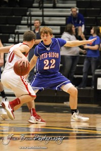 Greeley County Jackrabbit Troy Wineinger (#10) drives against the defense of Otis-Bison Cougar Patrick Piper (#22) in the 2012 Class 1A Division II Boys State Championship Quarterfinals Game at Gross Memorial Coliseum at Fort Hays State University in Hays, Kansas on March 7, 2012.  Photo: Joey Bahr