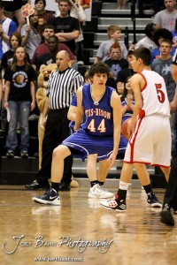 Brandon Pechanec (#44) of the Otis-Bison Cougars defends against Greeley County Jackrabbit Martin Veleta (#5) in the 2012 Class 1A Division II Boys State Championship Quarterfinals Game at Gross Memorial Coliseum at Fort Hays State University in Hays, Kansas on March 7, 2012.  Photo: Joey Bahr