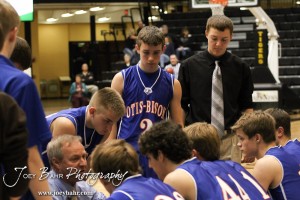 Otis-Bison Cougar Head Coach Alan Clark talks to his players during a timeout against the Greeley County Jackrabbits in the 2012 Class 1A Division II Boys State Championship Quarterfinals Game at Gross Memorial Coliseum at Fort Hays State University in Hays, Kansas on March 7, 2012.  Photo: Joey Bahr