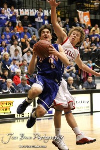 Trevor Keller (#3) of the Otis-Bison Cougars goes up for a shot while being defended by Greeley County Jackrabbit Chaz Schneider (#13) in the 2012 Class 1A Division II Boys State Championship Quarterfinals Game at Gross Memorial Coliseum at Fort Hays State University in Hays, Kansas on March 7, 2012.  Photo: Joey Bahr