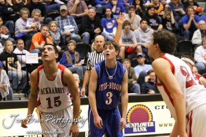 Greeley County Jackrabbit Cesar Yanez (#15) and Otis-Bison Cougar Trevor Keller (#3) watch the basketball during a free throw attempt in the 2012 Class 1A Division II Boys State Championship Quarterfinals Game at Gross Memorial Coliseum at Fort Hays State University in Hays, Kansas on March 7, 2012.  Photo: Joey Bahr