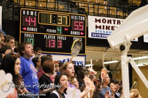 An Otis-Bison Cougar fan holds up a sign of Trevor Keller (#3) in the 2012 Class 1A Division II Boys State Championship Quarterfinals Game against the Greeley County Jackrabbits at Gross Memorial Coliseum at Fort Hays State University in Hays, Kansas on March 7, 2012.  Photo: Joey Bahr