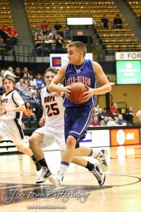 2012 Class 1A Division II Boys State Championship Semifinals Zachary Stejskal (#14) of the Otis-Bison Cougars down the court past Hope Lion Shilo Goracke (#25) in the 2012 Class 1A Division II Boys State Championship Semifinals Game at Gross Memorial Coliseum at Fort Hays State University in Hays, Kansas on March 9, 2012. Photo: Joey Bahr