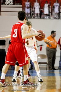 Andy Wilson (#4) of the Abilene Cowboys looks as Fort Scott Tiger Johnathan Stark (#3) sets up a play in the 2012 Class 4A Boys State Championship Quarterfinals Game at Salina Bicentennial Center in Salina, Kansas on March 8, 2012.  Photo: Joey Bahr