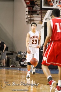 Abilene Cowboy Keil Kelly (#23) dribbles the basketball down the court against the Fort Scott Tigers in the 2012 Class 4A Boys State Championship Quarterfinals Game at Salina Bicentennial Center in Salina, Kansas on March 8, 2012.  Photo: Joey Bahr