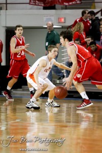 Matthew Barlow (#3) of the Abilene Cowboys defends Johnathan Stark (#3) of the Fort Scott Tigers in the 2012 Class 4A Boys State Championship Quarterfinals Game at Salina Bicentennial Center in Salina, Kansas on March 8, 2012.  Photo: Joey Bahr