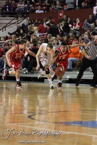 Abilene Cowboy Matthew Barlow (#3) and Fort Scott Tigers Cameron Woodring (#24) and Tyler Adams (#15) battle for a loose basketball in the 2012 Class 4A Boys State Championship Quarterfinals Game at Salina Bicentennial Center in Salina, Kansas on March 8, 2012.  Photo: Joey Bahr