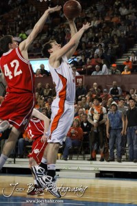 Jesse Patrick (#32) of the Abilene Cowboys goes up for a shot while Fort Scott Tiger Kyle Altic (#42) defends the 2012 Class 4A Boys State Championship Quarterfinals Game at Salina Bicentennial Center in Salina, Kansas on March 8, 2012.  Photo: Joey Bahr