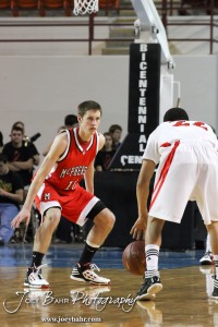 McPherson Bullpup Luke Reber (#10) defends Ottawa Cyclone Dallas Natt (#22) in the 2012 Class 4A Boys State Championship Quarterfinals Game at Salina Bicentennial Center in Salina, Kansas on March 8, 2012.  Photo: Joey Bahr