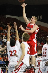 McPherson Bullpup Cody Cape (#42) goes up for a shot over the Ottawa Cyclones defense in the 2012 Class 4A Boys State Championship Quarterfinals Game at Salina Bicentennial Center in Salina, Kansas on March 8, 2012.  Photo: Joey Bahr