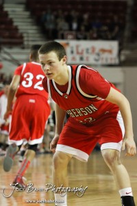 Kyler Kinnamon (#22) of the McPherson Bullpups gets into a defensive stance against the Ottawa Cyclones in the 2012 Class 4A Boys State Championship Quarterfinals Game at Salina Bicentennial Center in Salina, Kansas on March 8, 2012.  Photo: Joey Bahr