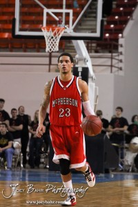 McPherson Bullpup Jordan Hart (#23) carries the basketball down the court against the Ottawa Cyclones in the 2012 Class 4A Boys State Championship Quarterfinals Game at Salina Bicentennial Center in Salina, Kansas on March 8, 2012.  Photo: Joey Bahr