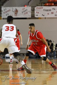 McPherson Bullpup Travell Robinson (#32) defends against Ottawa Cyclone Semi Ojeleye (#33) in the 2012 Class 4A Boys State Championship Quarterfinals Game at Salina Bicentennial Center in Salina, Kansas on March 8, 2012.  Photo: Joey Bahr
