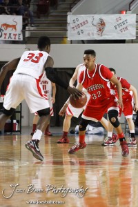 McPherson Bullpup Travell Robinson (#32) defends against Ottawa Cyclone Semi Ojeleye (#33) in the 2012 Class 4A Boys State Championship Quarterfinals Game at Salina Bicentennial Center in Salina, Kansas on March 8, 2012.  Photo: Joey Bahr