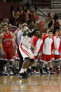 Semi Ojeleye (#33) of the Ottawa Cyclones looks for a teammate to pass the basketball to against the McPherson Bullpups in the 2012 Class 4A Boys State Championship Quarterfinals Game at Salina Bicentennial Center in Salina, Kansas on March 8, 2012.  Photo: Joey Bahr