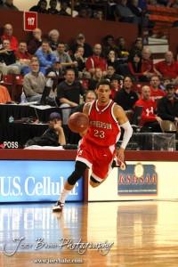 McPherson Bullpup Jordan Hart (#23) drives down the court with the basketball against the Ottawa Cyclones in the 2012 Class 4A Boys State Championship Quarterfinals Game at Salina Bicentennial Center in Salina, Kansas on March 8, 2012.  Photo: Joey Bahr