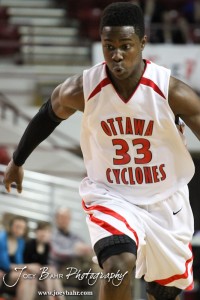 Semi Ojeleye (#33) of the Ottawa Cyclones drives into the McPherson Bullpups defense in the 2012 Class 4A Boys State Championship Quarterfinals Game at Salina Bicentennial Center in Salina, Kansas on March 8, 2012.  Photo: Joey Bahr