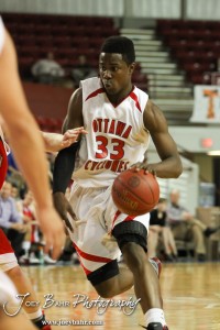 Semi Ojeleye (#33) of the Ottawa Cyclones drives into the McPherson Bullpups defense in the 2012 Class 4A Boys State Championship Quarterfinals Game at Salina Bicentennial Center in Salina, Kansas on March 8, 2012.  Photo: Joey Bahr