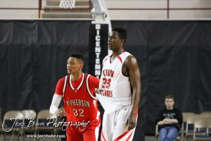 McPherson Bullpup Travell Robinson (#32) and Ottawa Cyclone Semi Ojeleye (#33) wait for the basketball to cross the half court line in the 2012 Class 4A Boys State Championship Quarterfinals Game at Salina Bicentennial Center in Salina, Kansas on March 8, 2012.  Photo: Joey Bahr