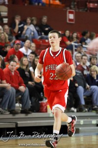 Kyler Kinnamon (#22) of the McPherson Bullpups carries the basketball down the court against the McPherson Bullpups in the 2012 Class 4A Boys State Championship Quarterfinals Game at Salina Bicentennial Center in Salina, Kansas on March 8, 2012.  Photo: Joey Bahr