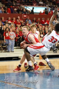 McPherson Bullpup Cody Cape (#42) drives into Ottawa Cyclone Semi Ojeleye (#33) in the 2012 Class 4A Boys State Championship Quarterfinals Game at Salina Bicentennial Center in Salina, Kansas on March 8, 2012.  Photo: Joey Bahr