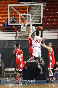 Semi Ojeleye (#33) of the Ottawa Cyclones goes up for a shot against the McPherson Bullpups defense in the 2012 Class 4A Boys State Championship Quarterfinals Game at Salina Bicentennial Center in Salina, Kansas on March 8, 2012.  Photo: Joey Bahr