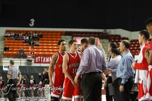McPherson Bullpup Seniors are greeted by their teammates as the come off the court for the last time against the Ottawa Cyclones in the 2012 Class 4A Boys State Championship Quarterfinals Game at Salina Bicentennial Center in Salina, Kansas on March 8, 2012.  Photo: Joey Bahr