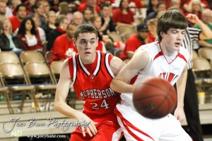 Alex Bahr (#24) of the McPherson Bullpups tries to get around an Ottawa Cyclone in the 2012 Class 4A Boys State Championship Quarterfinals Game at Salina Bicentennial Center in Salina, Kansas on March 8, 2012.  Photo: Joey Bahr