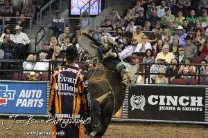 Championship Bull Riding Roto-Mix Dodge City Shootout Aaron Pass tries to stay on Lumberjack from Rawson Bucking Bulls in the Championship Bull Riding Roto-Mix Dodge City Shootout at United Wireless Arena in Dodge City, Kansas on March 17, 2012. Photo: Joey Bahr