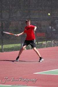 Great Bend Invitiational Boys Tennis Tournament A Great Bend player returns a volley during the Great Bend Invitiational Boys Tennis Tournament at Great Bend High School in Great Bend, Kansas on March 31, 2012. (Photo: Joey Bahr, www.joeybahr.com)